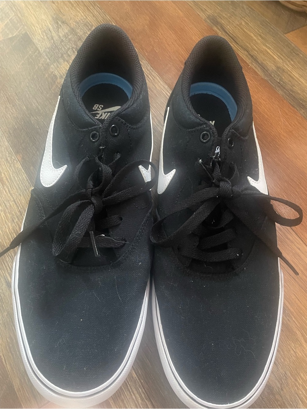 Nike Black Low-Top Sneakers with White Swoosh